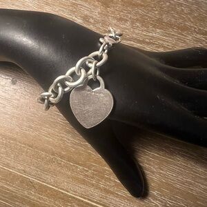 Tiffany and Co. 8” Sterling Silver Bracelet with a 1” Charm.